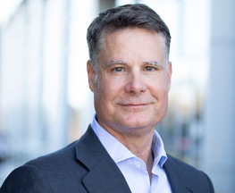 Portrait of Andrew Dickinson, CFO of Gilead Sciences, Inc.