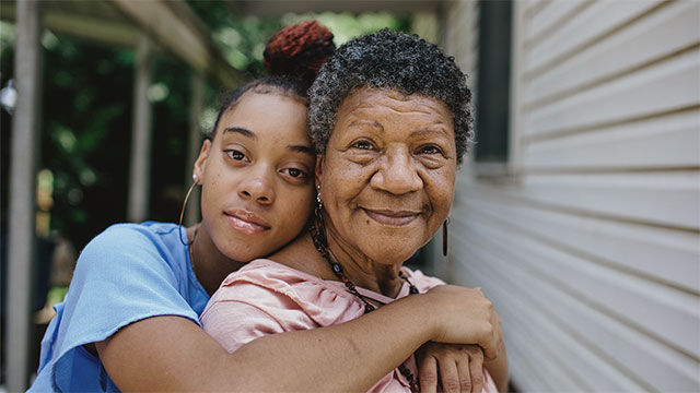 A young woman and an older woman embracing